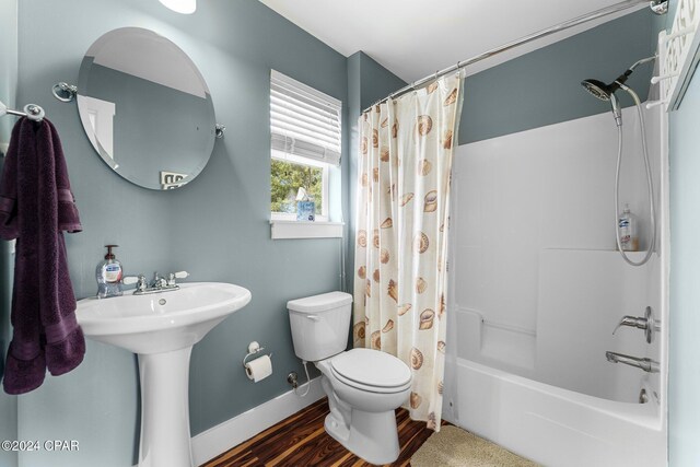 full bathroom featuring shower / bath combination with curtain, toilet, wood-type flooring, and sink