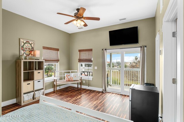 interior space featuring ceiling fan, a healthy amount of sunlight, and wood-type flooring