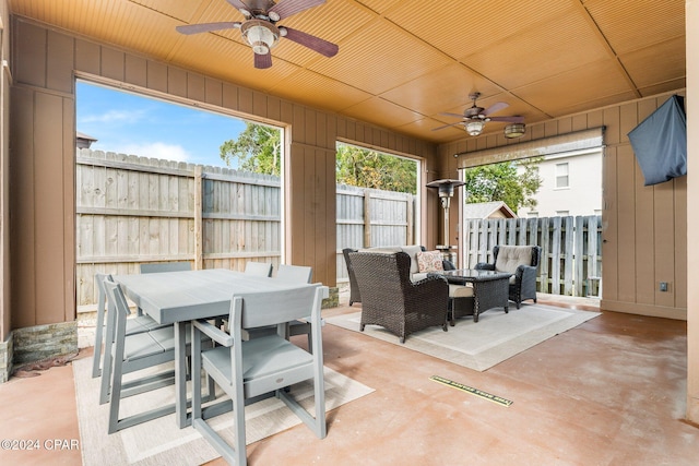 313 Argonaut St, Panama City Beach, FL 32413 - view of patio featuring fence, an outdoor living space, a ceiling fan, and outdoor dining space