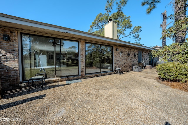 back of house with a patio area