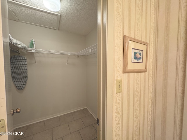 spacious closet featuring tile patterned floors