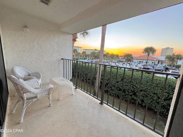 view of balcony at dusk