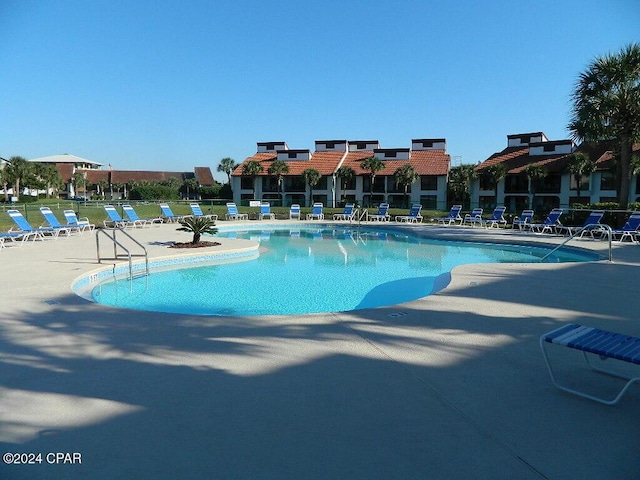 view of pool featuring a patio area