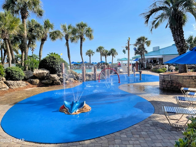 view of swimming pool with a water view