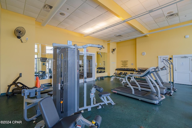 workout area featuring a drop ceiling