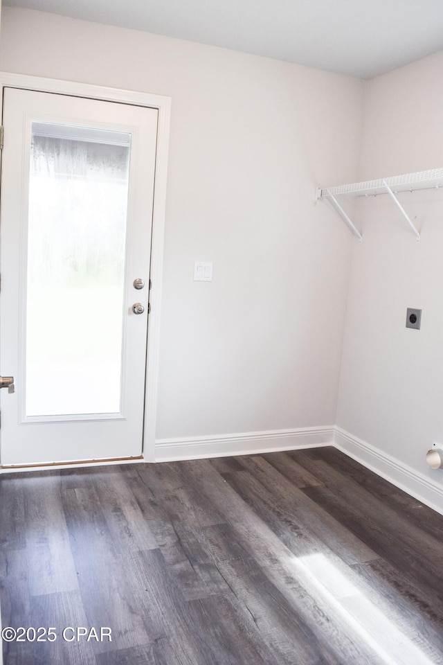 clothes washing area with laundry area, plenty of natural light, electric dryer hookup, and dark wood-type flooring