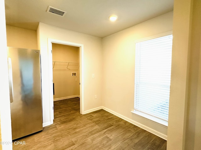 spare room with wood-type flooring