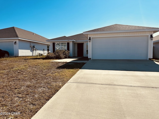 ranch-style house featuring a garage