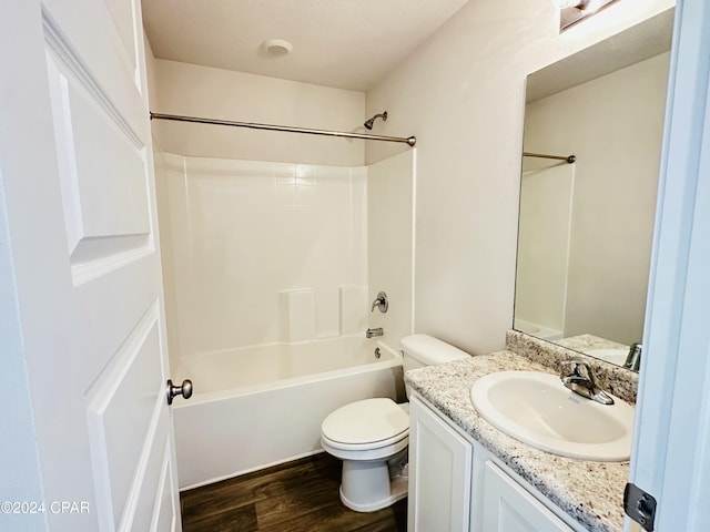 full bathroom featuring toilet, vanity, shower / bathtub combination, and hardwood / wood-style flooring