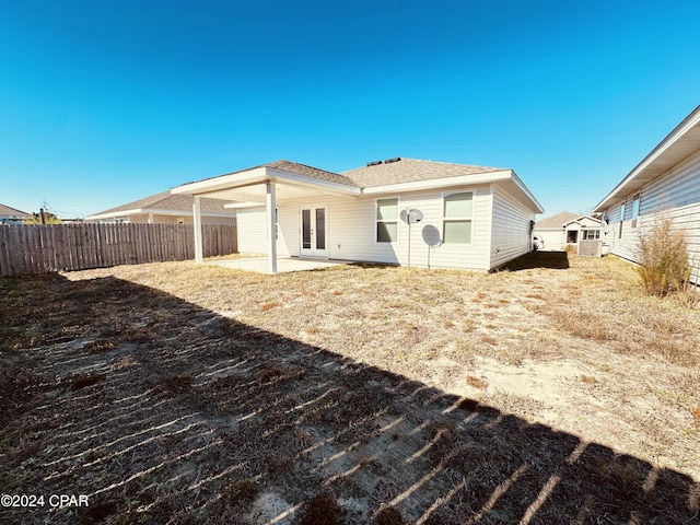 back of house with a patio area and french doors