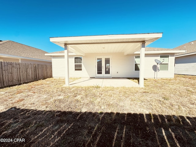 rear view of house featuring french doors and a patio