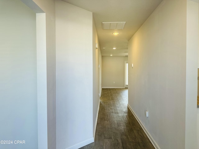 hall with dark hardwood / wood-style floors