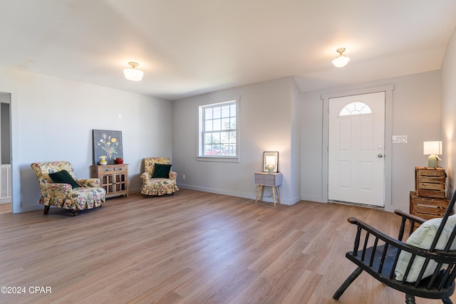 sitting room featuring light wood-style floors and baseboards