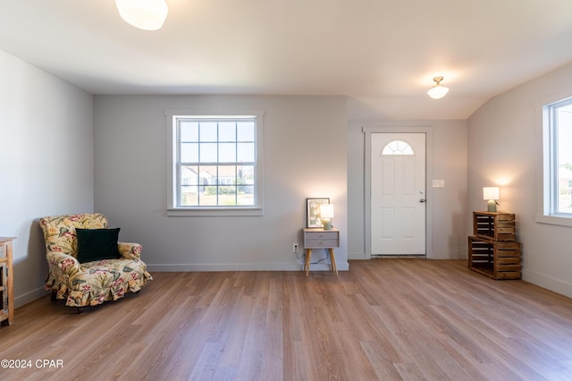 entryway featuring light wood finished floors and baseboards