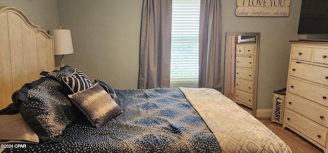 bedroom featuring dark colored carpet