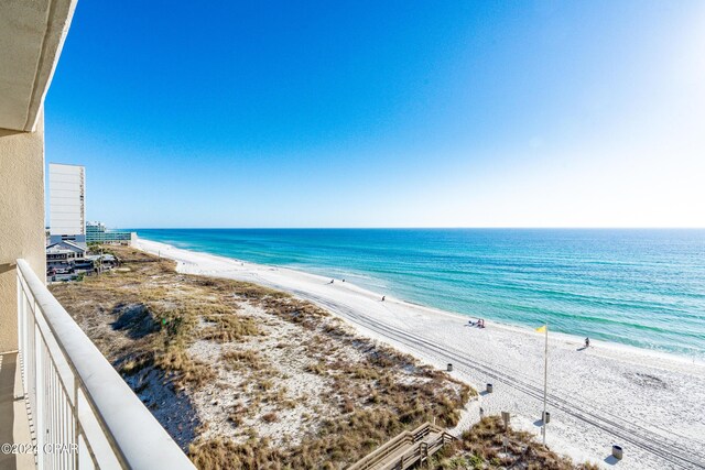 view of community with a water view and a view of the beach