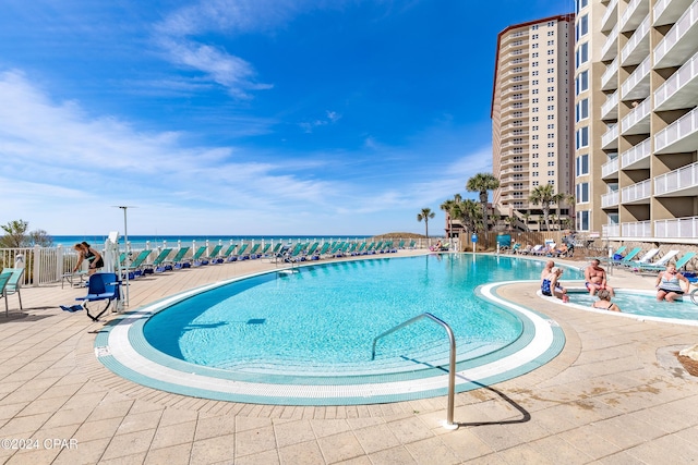 community pool featuring a patio area