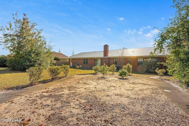 rear view of house with a lawn and cooling unit