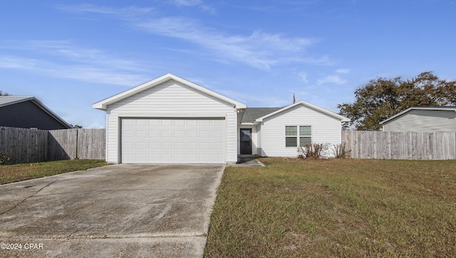 ranch-style house featuring a front yard and a garage