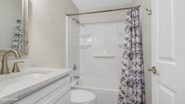 full bathroom featuring vanity, shower / tub combo, and toilet