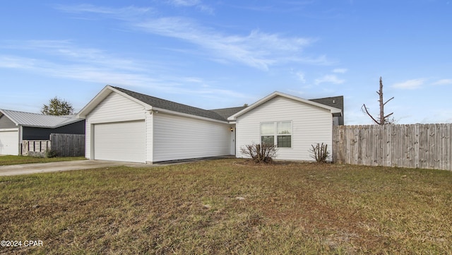 ranch-style house with a front lawn and a garage