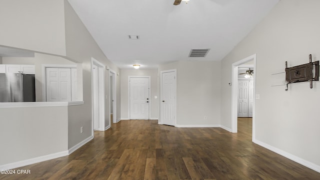 hallway with dark hardwood / wood-style flooring