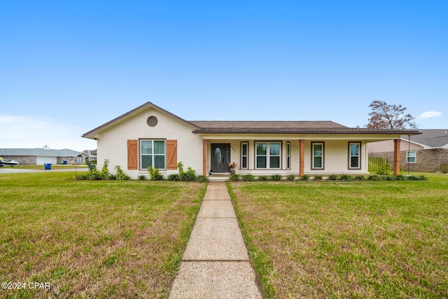 ranch-style home with a front yard and covered porch