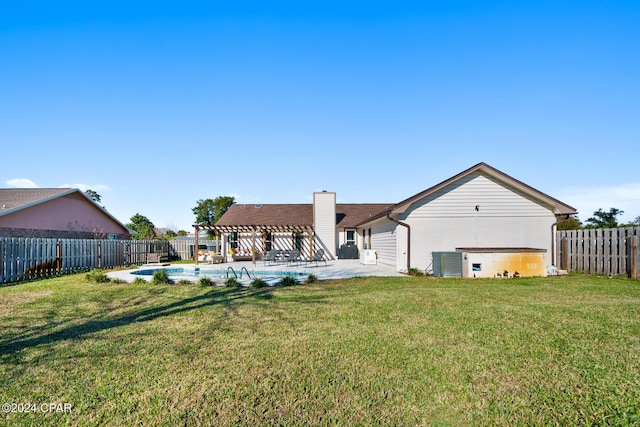 back of property featuring a fenced in pool, central AC unit, a patio area, and a lawn