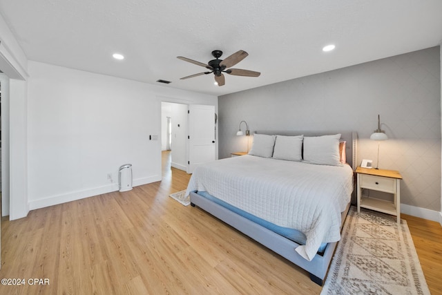 bedroom featuring hardwood / wood-style flooring and ceiling fan