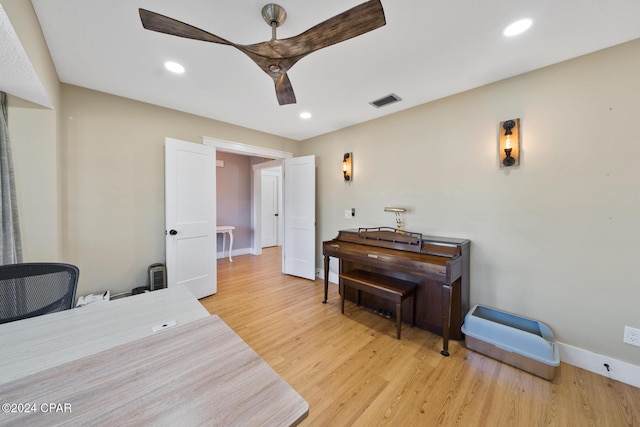 office featuring ceiling fan and light wood-type flooring