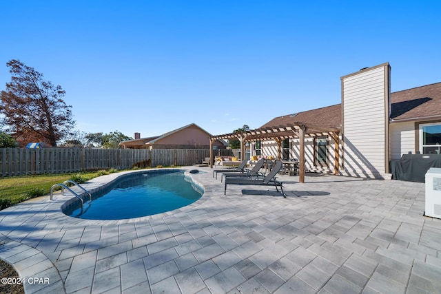 view of swimming pool with a patio area and a pergola