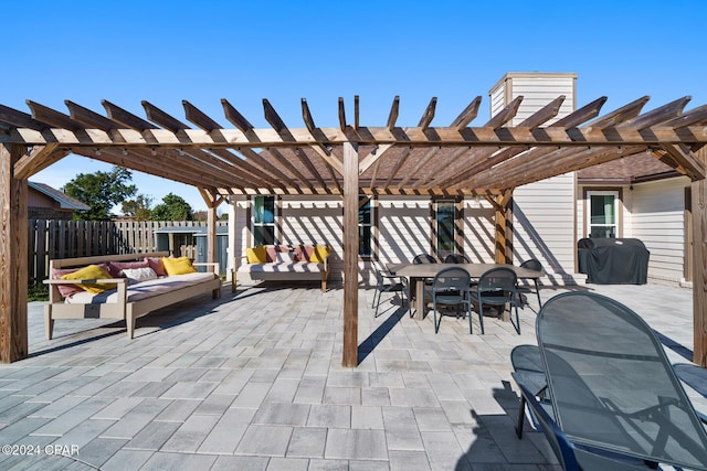 view of patio with an outdoor living space, a pergola, and grilling area