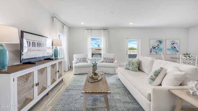 living room featuring recessed lighting and light wood-style floors