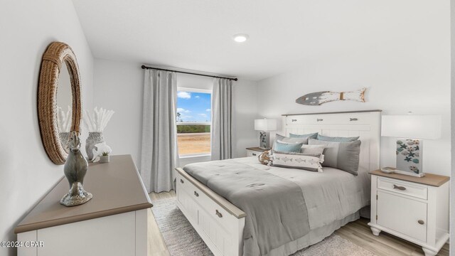 bedroom with light hardwood / wood-style flooring