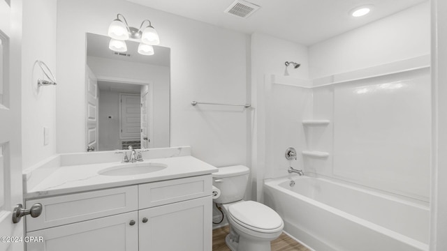 bathroom with visible vents, shower / bathtub combination, toilet, and vanity