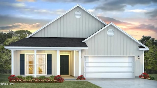 view of front facade with board and batten siding, concrete driveway, a garage, and a shingled roof