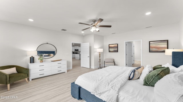 bedroom featuring recessed lighting, visible vents, and light wood finished floors