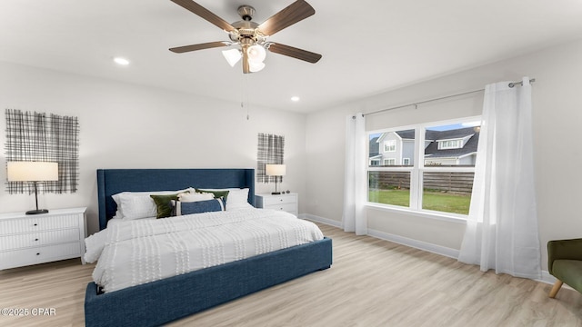 bedroom featuring recessed lighting, baseboards, light wood-type flooring, and ceiling fan