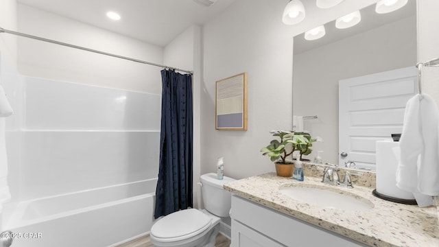 full bathroom featuring vanity, shower / tub combo, and toilet