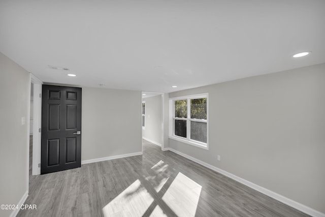 unfurnished room featuring light hardwood / wood-style floors