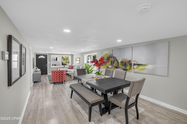 dining area with recessed lighting, baseboards, and light wood-style floors