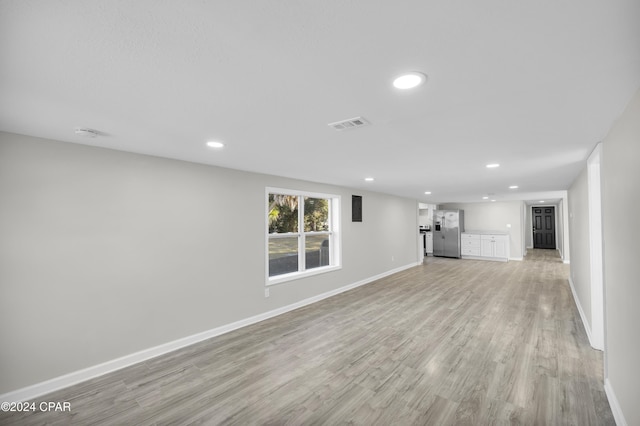 unfurnished living room featuring light wood-type flooring