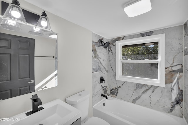 bathroom with vanity, shower / tub combination, and toilet