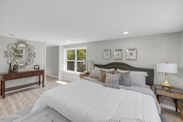 kitchen with stove, white cabinets, sink, light hardwood / wood-style flooring, and dishwasher