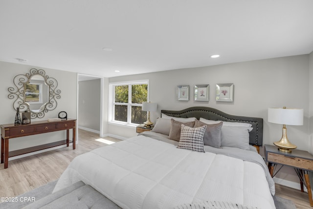 bedroom featuring light wood-style flooring, recessed lighting, and baseboards