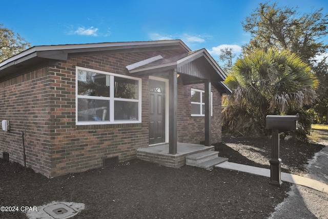 view of front of property featuring brick siding