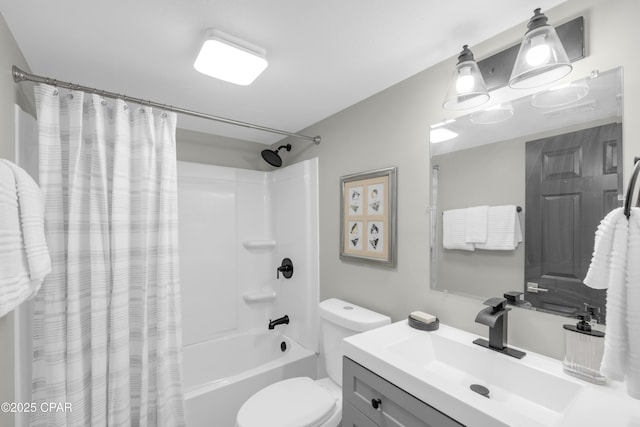 bathroom with toilet, vanity, and shower / tub combo