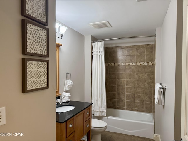 full bathroom featuring tile patterned floors, shower / bath combination with curtain, toilet, and vanity