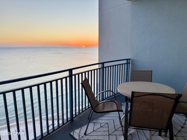 balcony at dusk with a water view