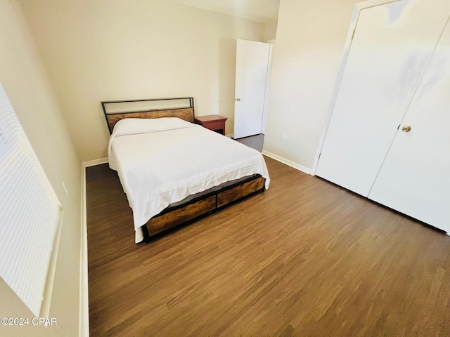 bedroom with hardwood / wood-style floors